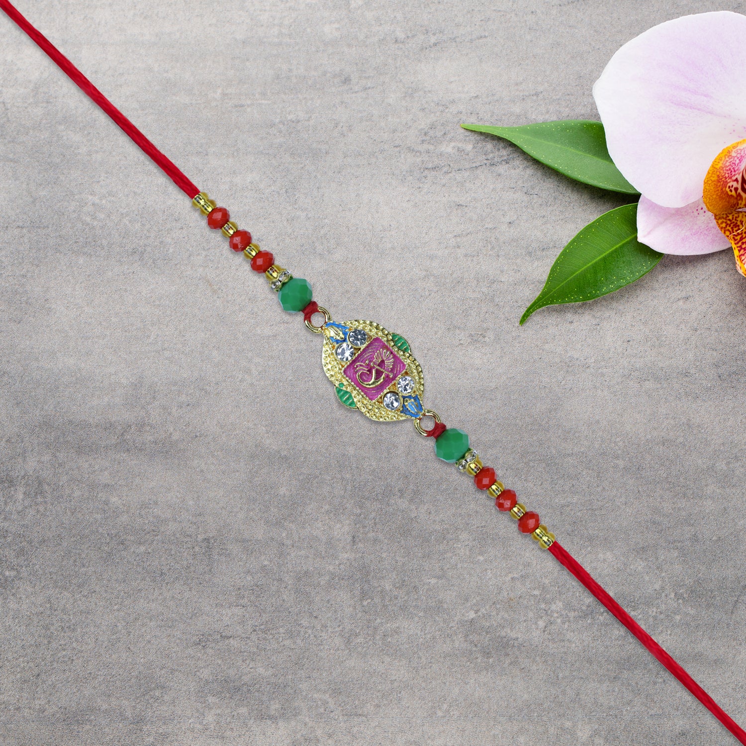 Om Rakhi With Decorative Beads And Stone Work Om Rakhi With Decorative Beads And Stone Work